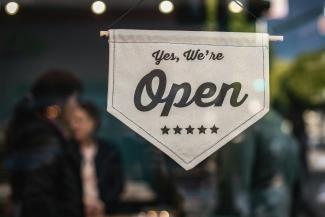 an open sign in a shop window